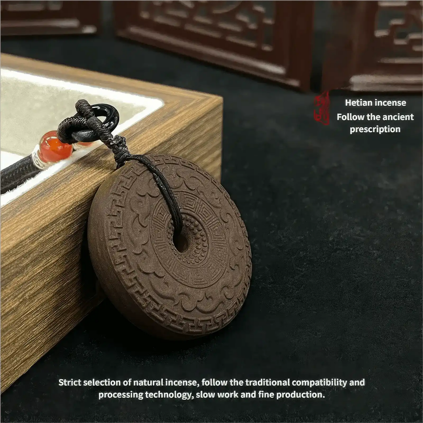 Ambergris Peace Amulet incense pendant shown near a wooden box, with text stating "Hetian Incense Secret Recipe" and "Strict selection of natural incense, follow the traditional compatibility and processing technology, slow work and fine production".