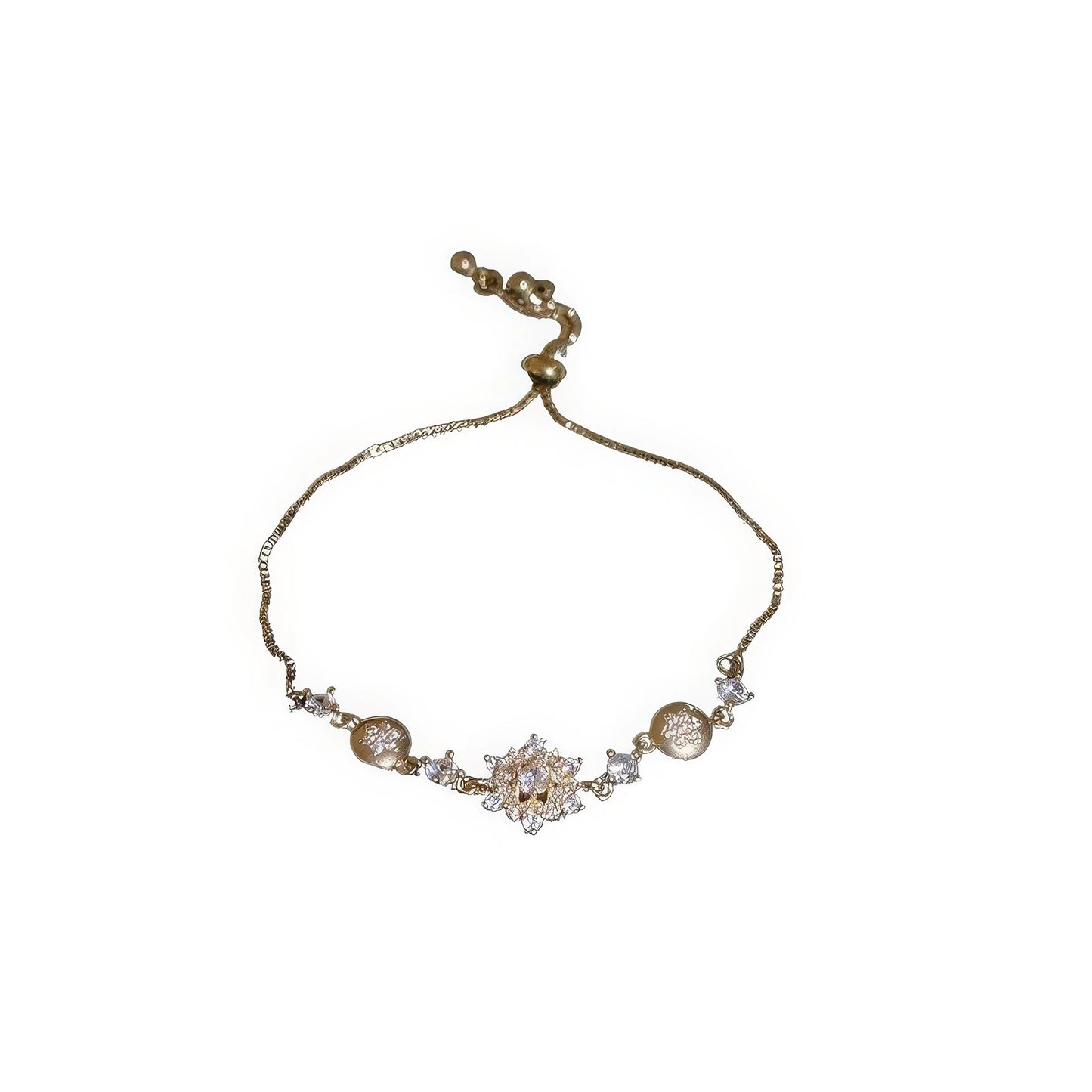 Gold diamond - inlaid snowflake pendant bracelet isolated on white background.
