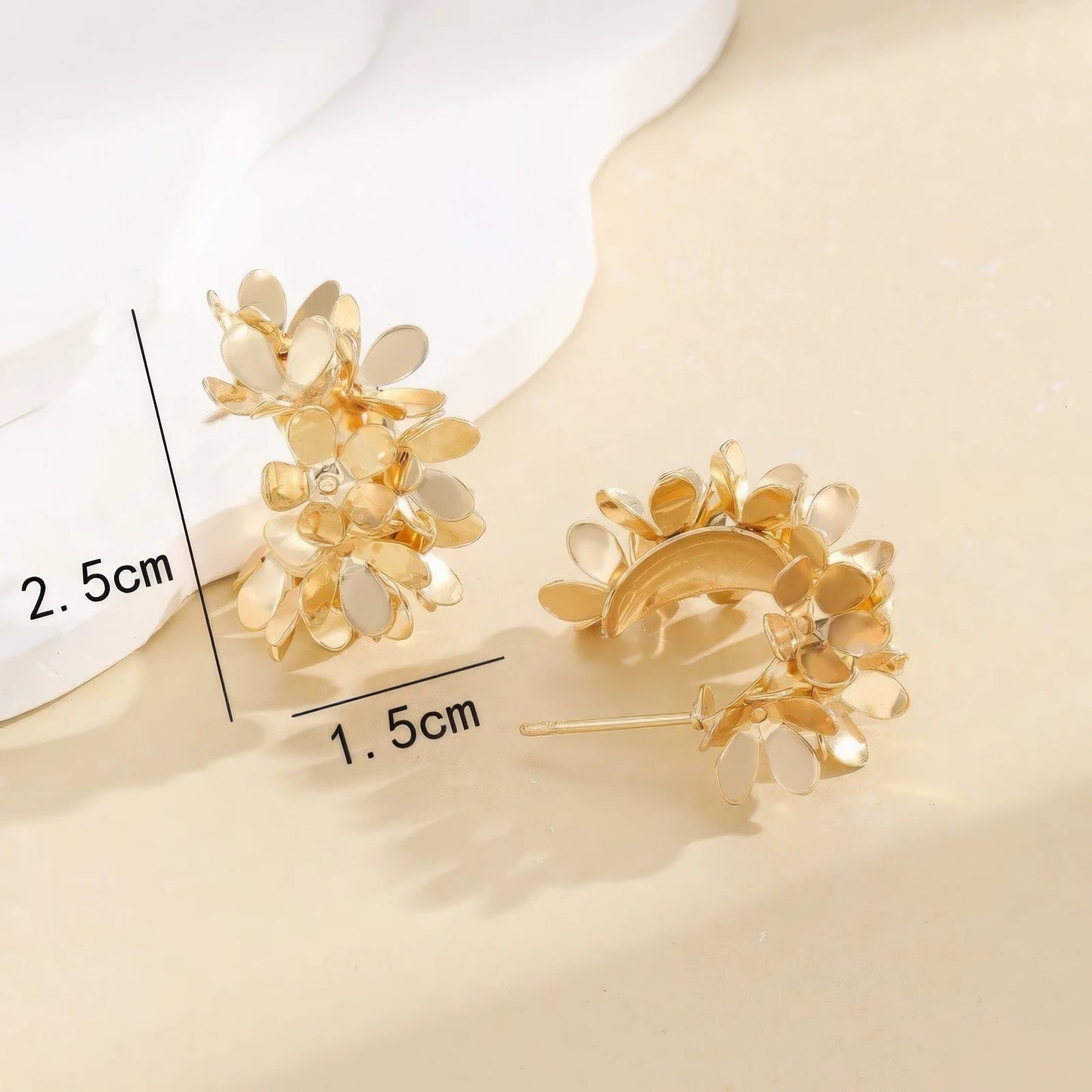 Gold floral curved earrings with size info (2.5cm and 1.5cm), highlighting the detailed, flower - clustered structure