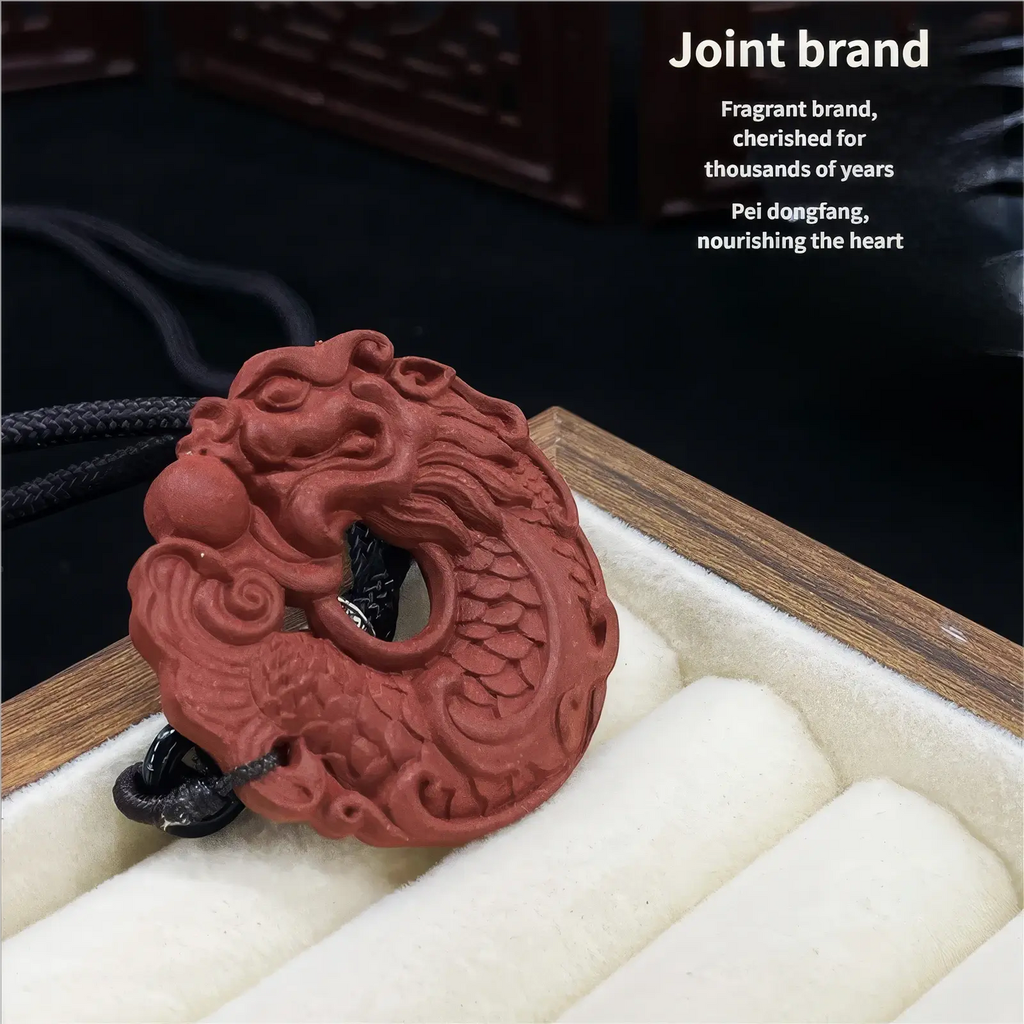 Huarui Incense - Carp Transforming into Dragon incense pendant shown with the "Joint brand" label, placed in a box with white lining, highlighting the red - colored pendant with dragon and carp carvings.