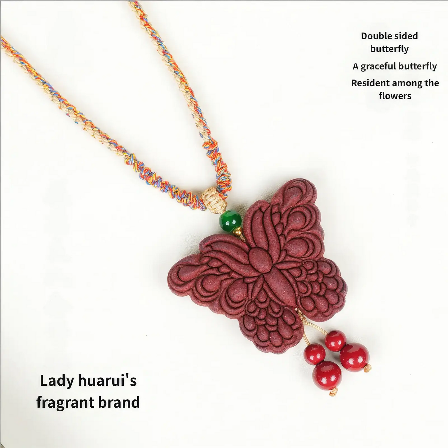 Full view of the Lady Huarui - Double-Sided Butterfly Incense Pendant on a colorful woven cord. The text on the image reads "Lady huarui's fragrant brand" and "Double sided butterfly. A graceful butterfly lingers among the flowers".