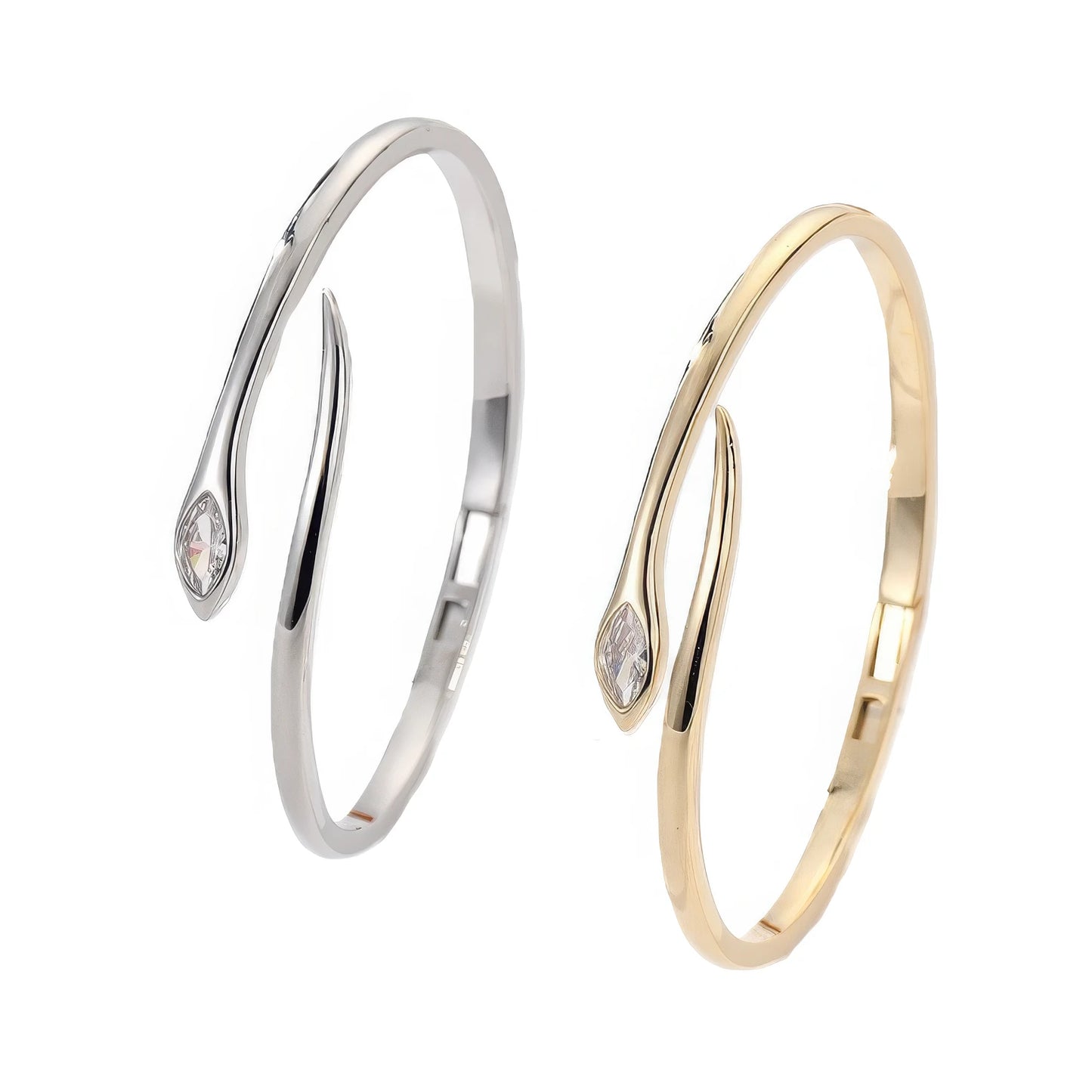 Pair of sparkling diamond agile snake bracelets (silver and gold) isolated on white background.