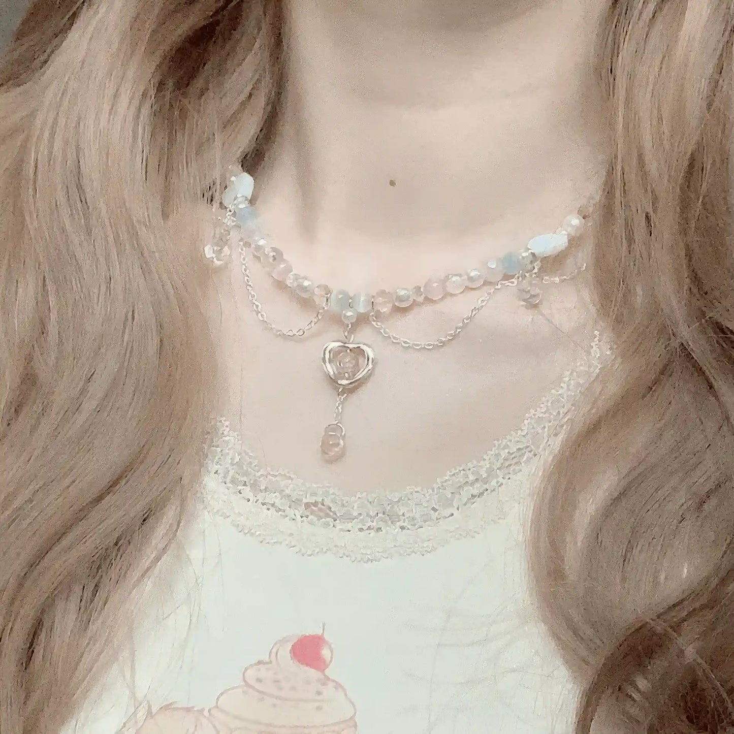 Woman wearing layered ballet - style ribbon bow necklace with a lace - trimmed to