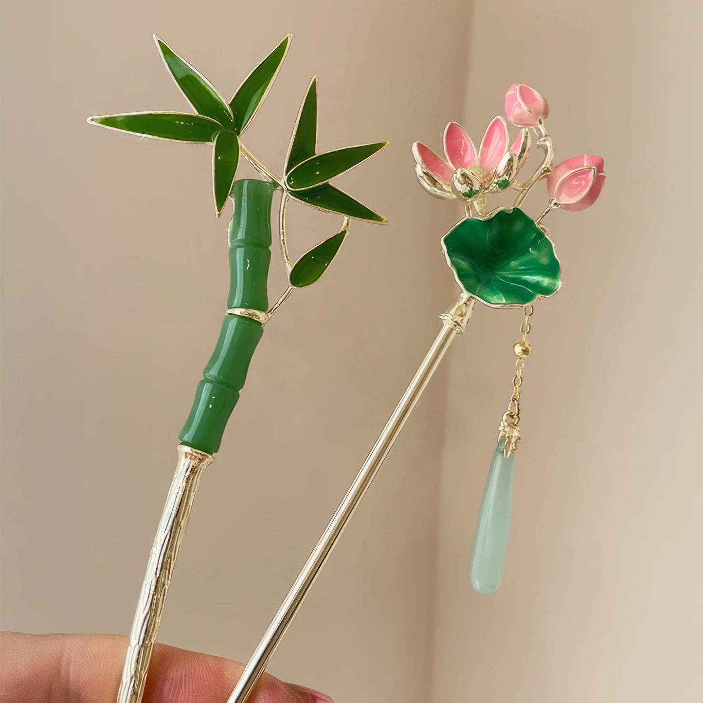 Bamboo and lotus hairpins displayed together, dual-style contrast