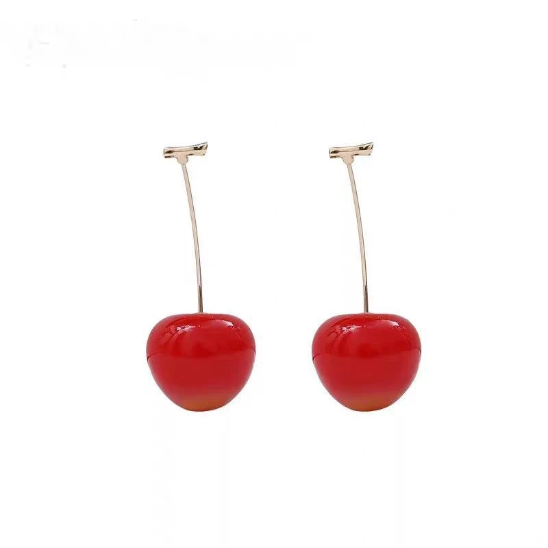 Pair of red cherry - shaped earrings, isolated on white background