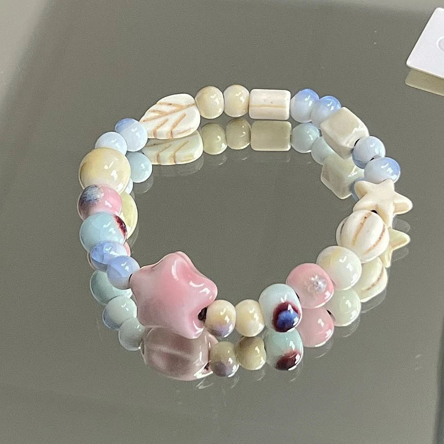 Crackle glaze ceramic bracelet with pink star and mixed color beads