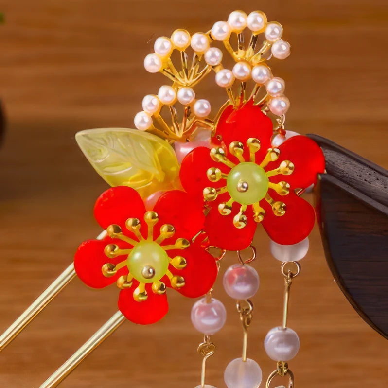 Dream Butterfly hairpin with red flowers and pearl tassel, wooden background