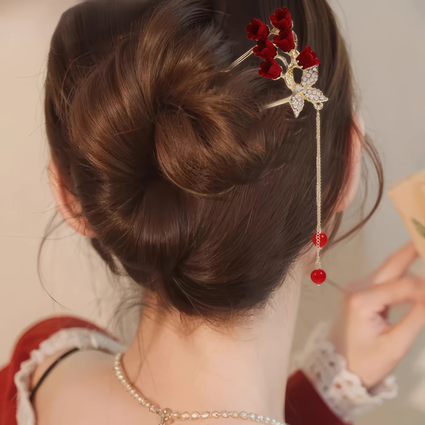 Feihong U - shaped hairpin with red roses, diamond - like butterfly and red bead tassel, worn in updo hairstyle