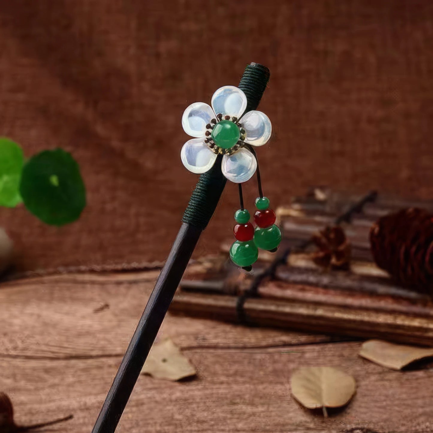 Folian hairpin 9 with white flower and green beads, wooden background