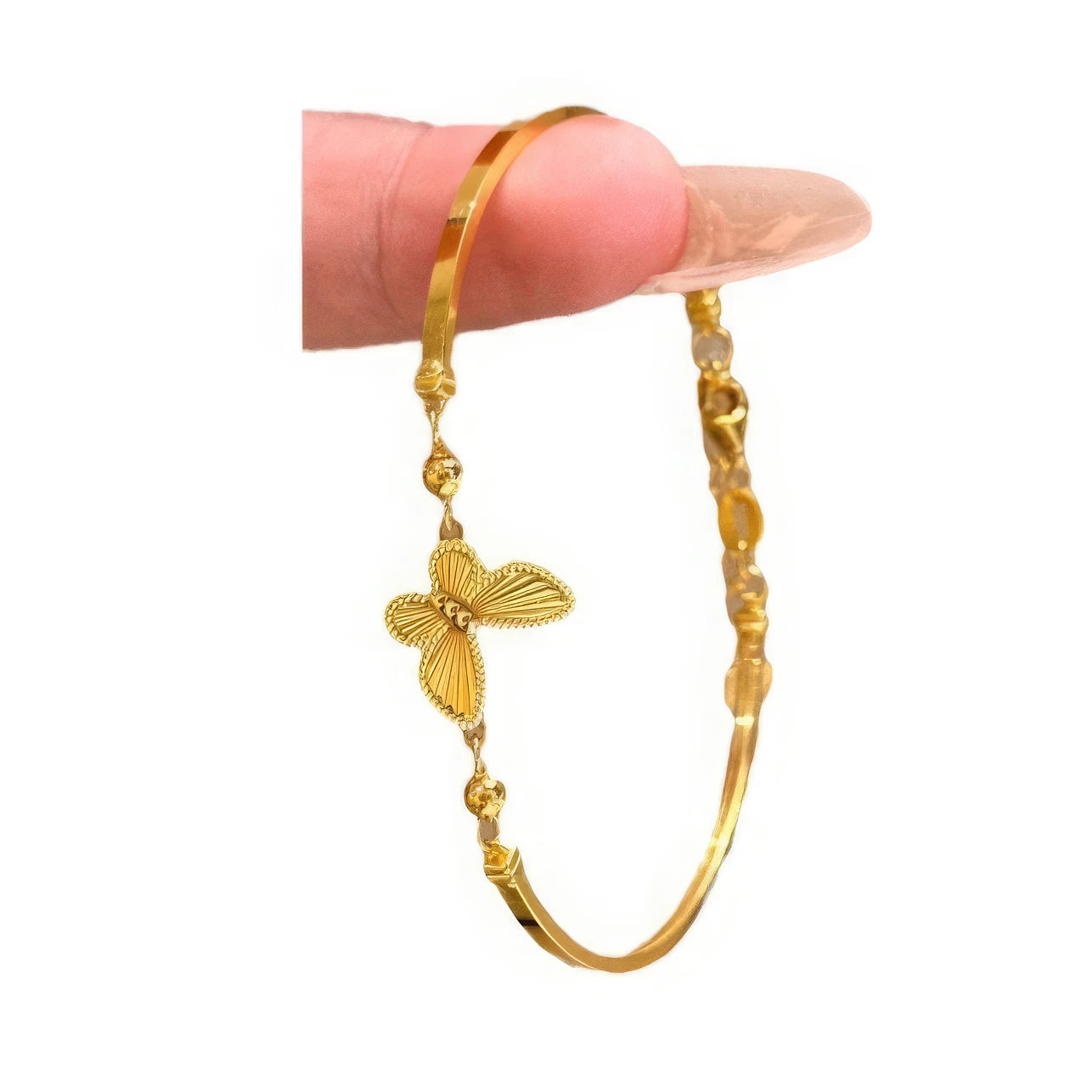 Another hand holding gold butterfly bracelet, close - up view