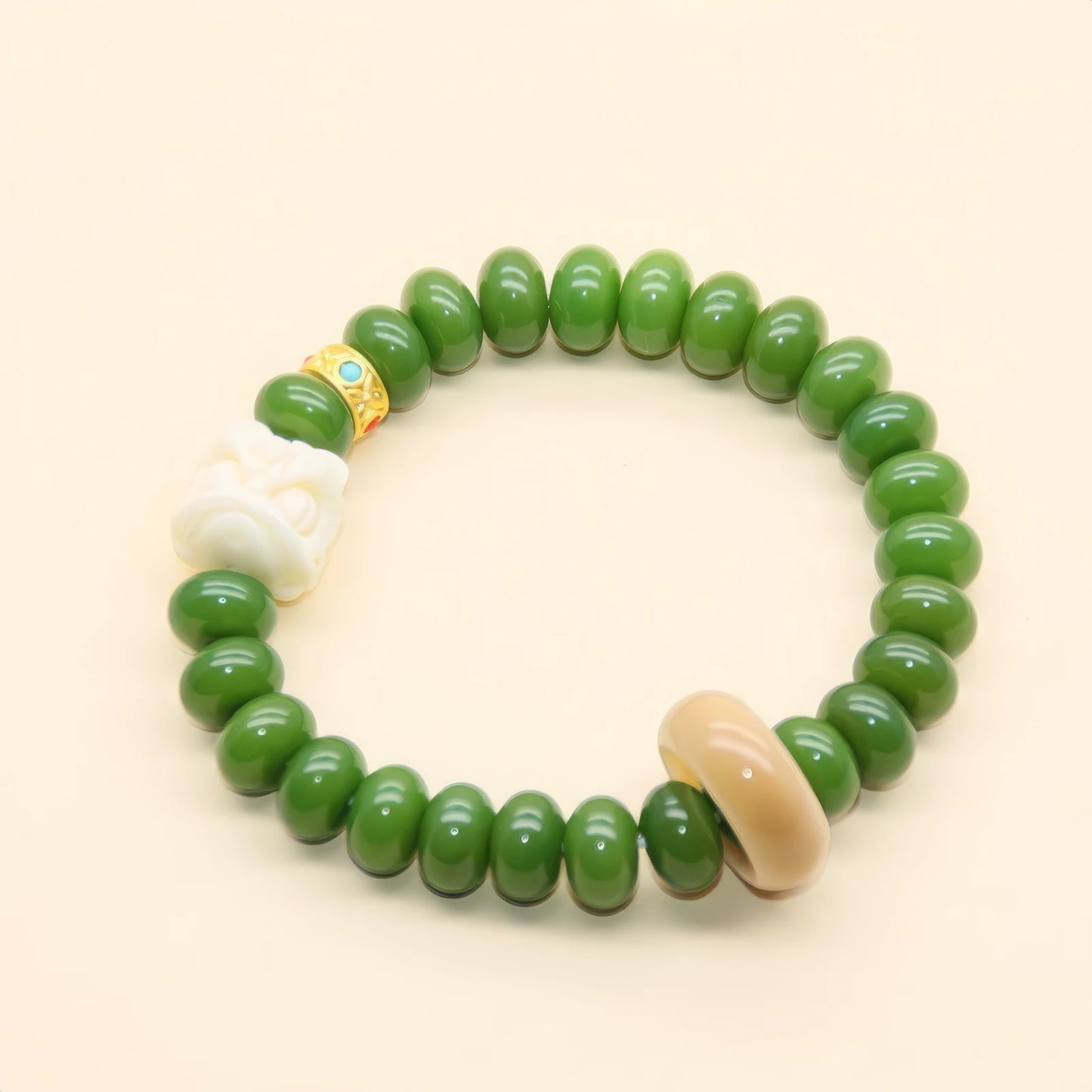 Single - strand green bodhi bracelet with white and beige accent beads, highlighting simplicity