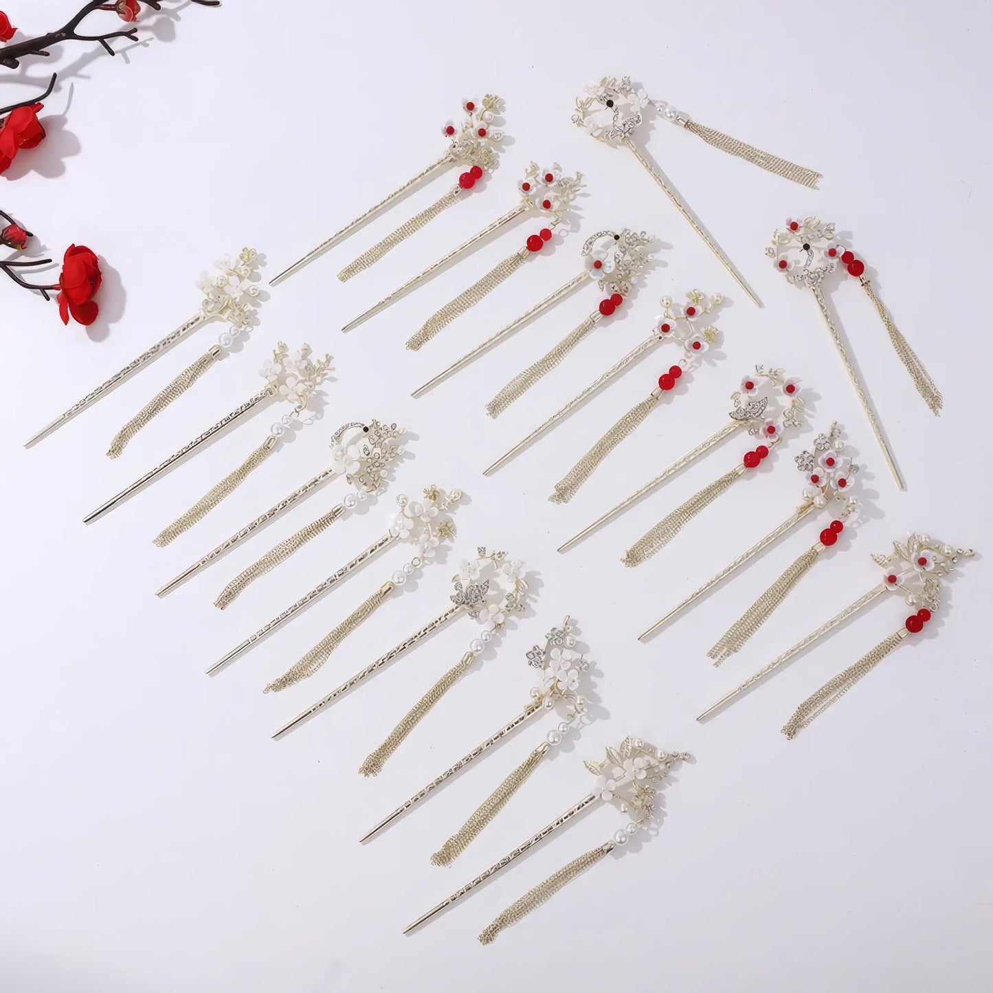 Set of Houtinghua hairpins with various floral and bead designs, gold tassels