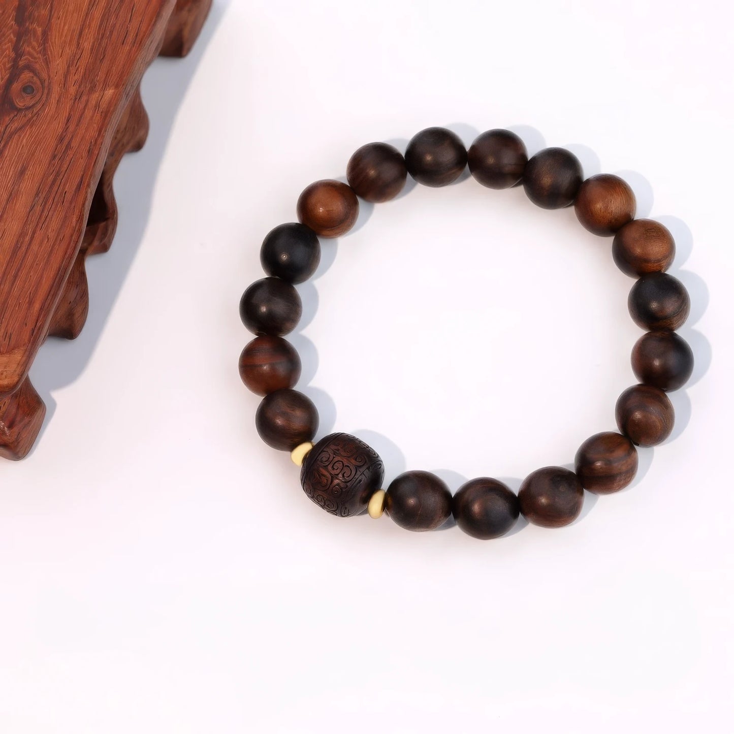 Natural wood bracelet with carved bead, isolated on white background, clear details