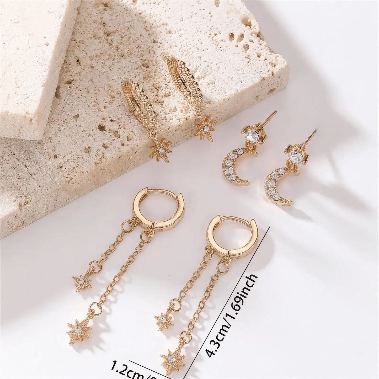 Gold star moon chain tassel earrings displayed with size info, emphasizing design
