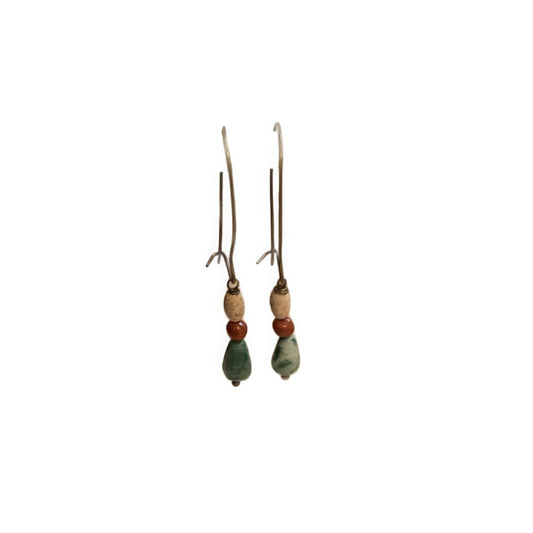  Pair of agate picture stone pendant earrings, isolated on white background, emphasizing the detailed bead and teardrop - shaped stone structure.