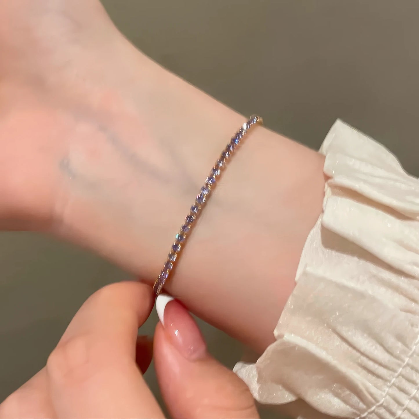Single amethyst - related bracelet (without butterfly) worn on wrist.