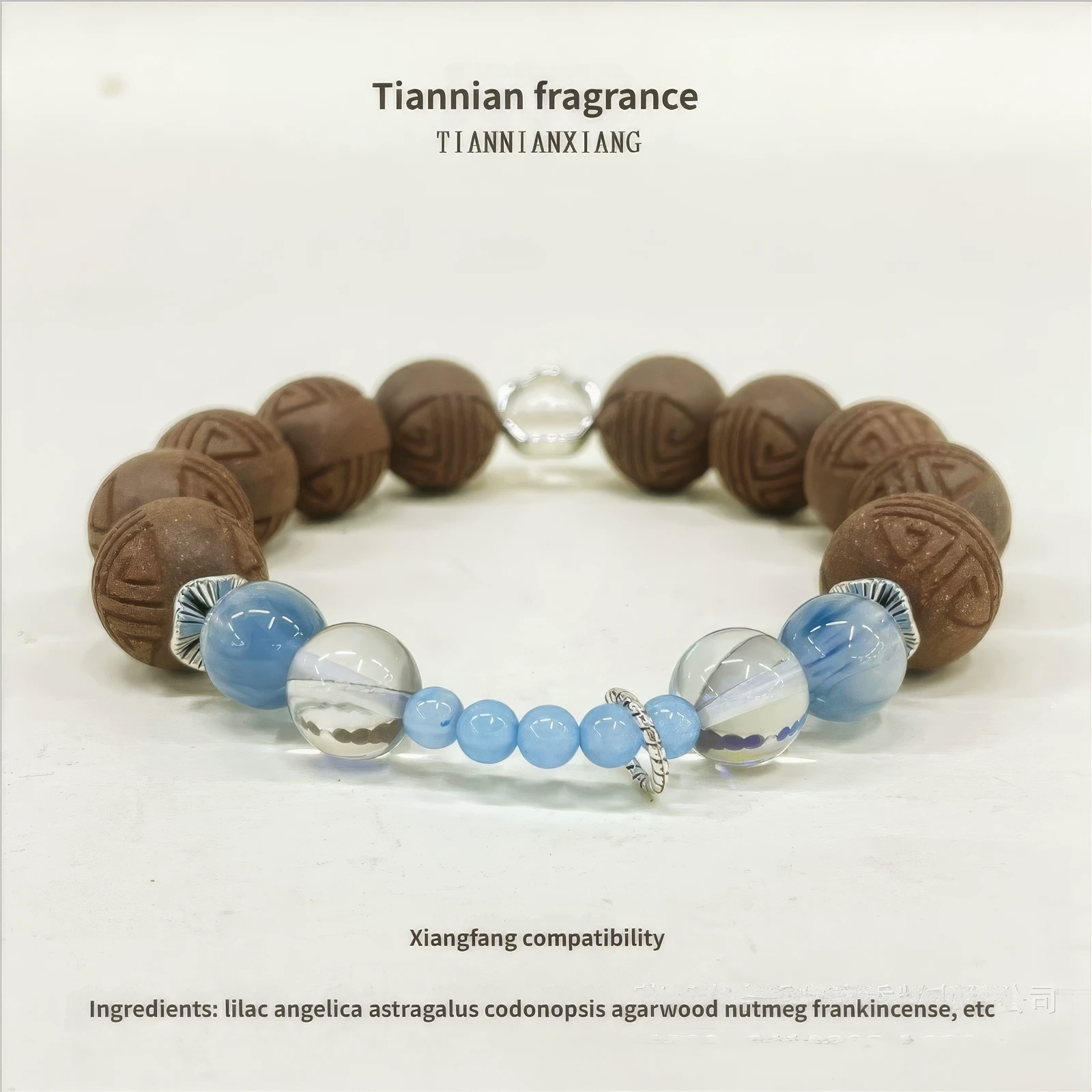 Full - view of the codonopsis and lilac bracelet, featuring brown patterned beads, blue and clear crystal beads.