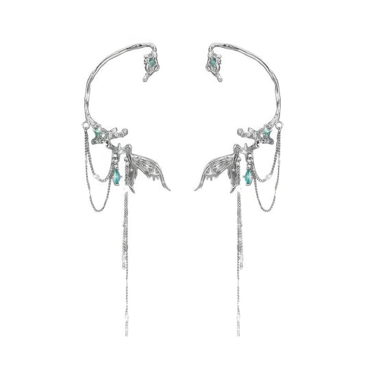Cool fish tail tassel ear cuff isolated on white background, highlighting the silver - toned design with turquoise accents.