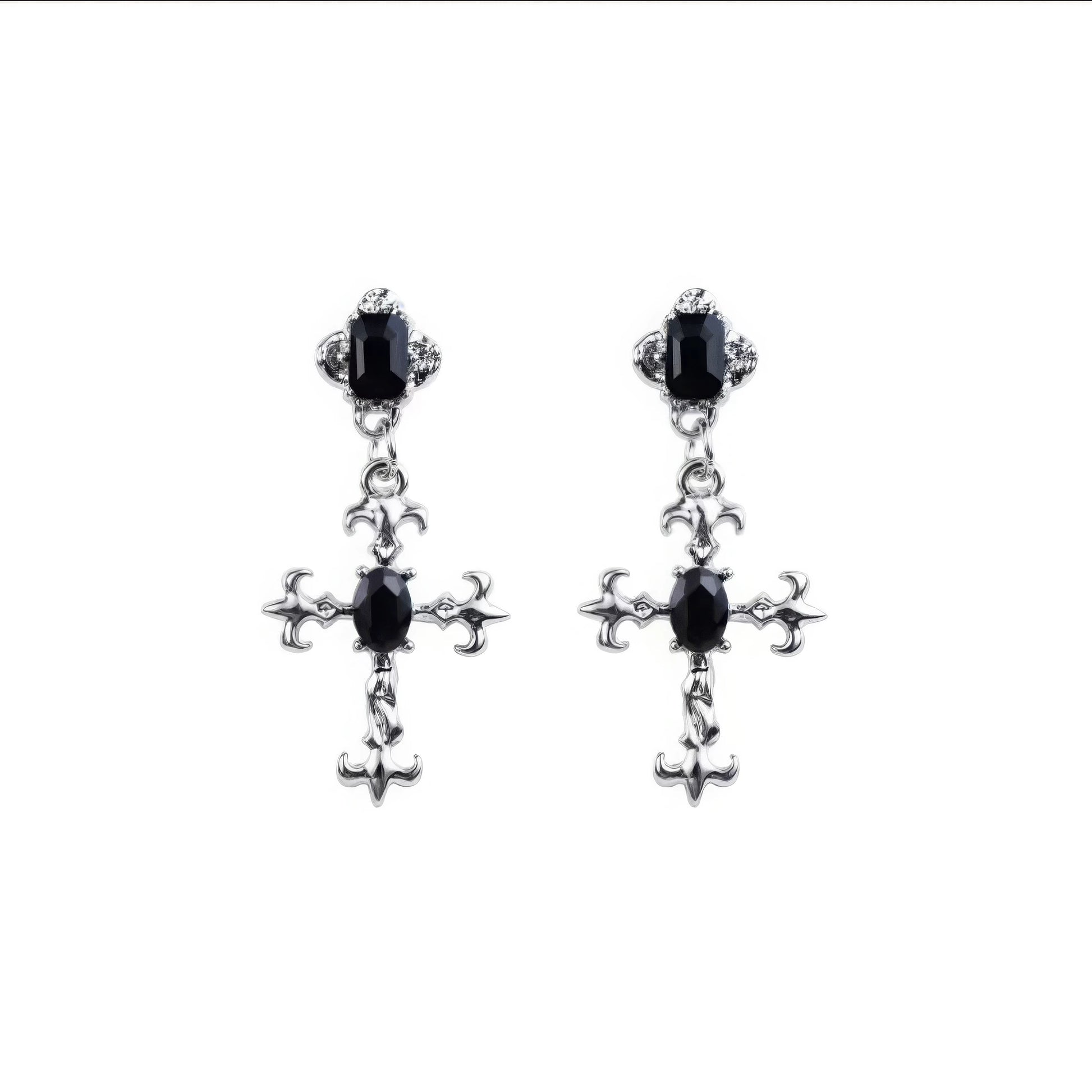 Pair of dark gem cross earrings isolated on white background