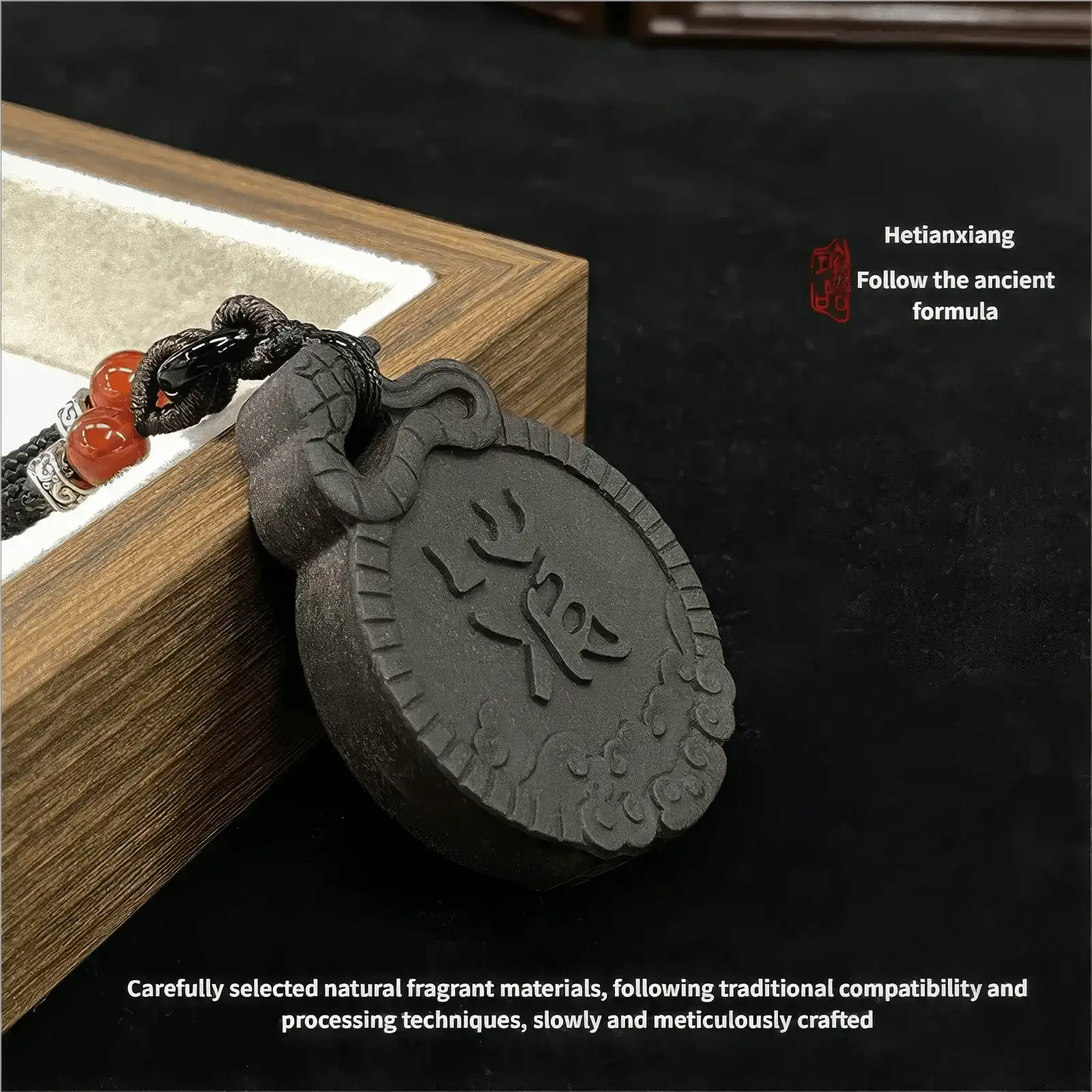 Exorcism Charm incense pendant placed beside a wooden box, with text explaining the careful selection of natural fragrant materials, following traditional compatibility and processing techniques, and slow, meticulous crafting.