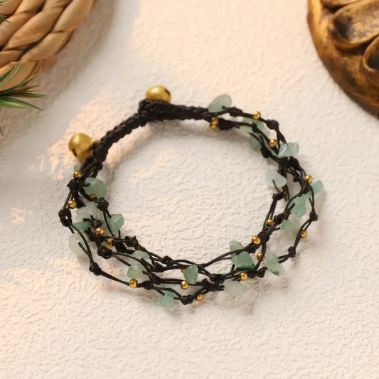  Forest - style retro crystal bracelet with green crystals, isolated on a light background.