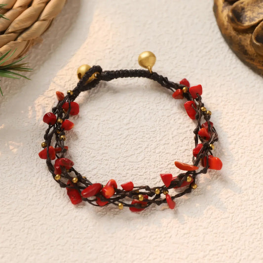 Forest - style retro crystal bracelet with red crystals, isolated on a light background.