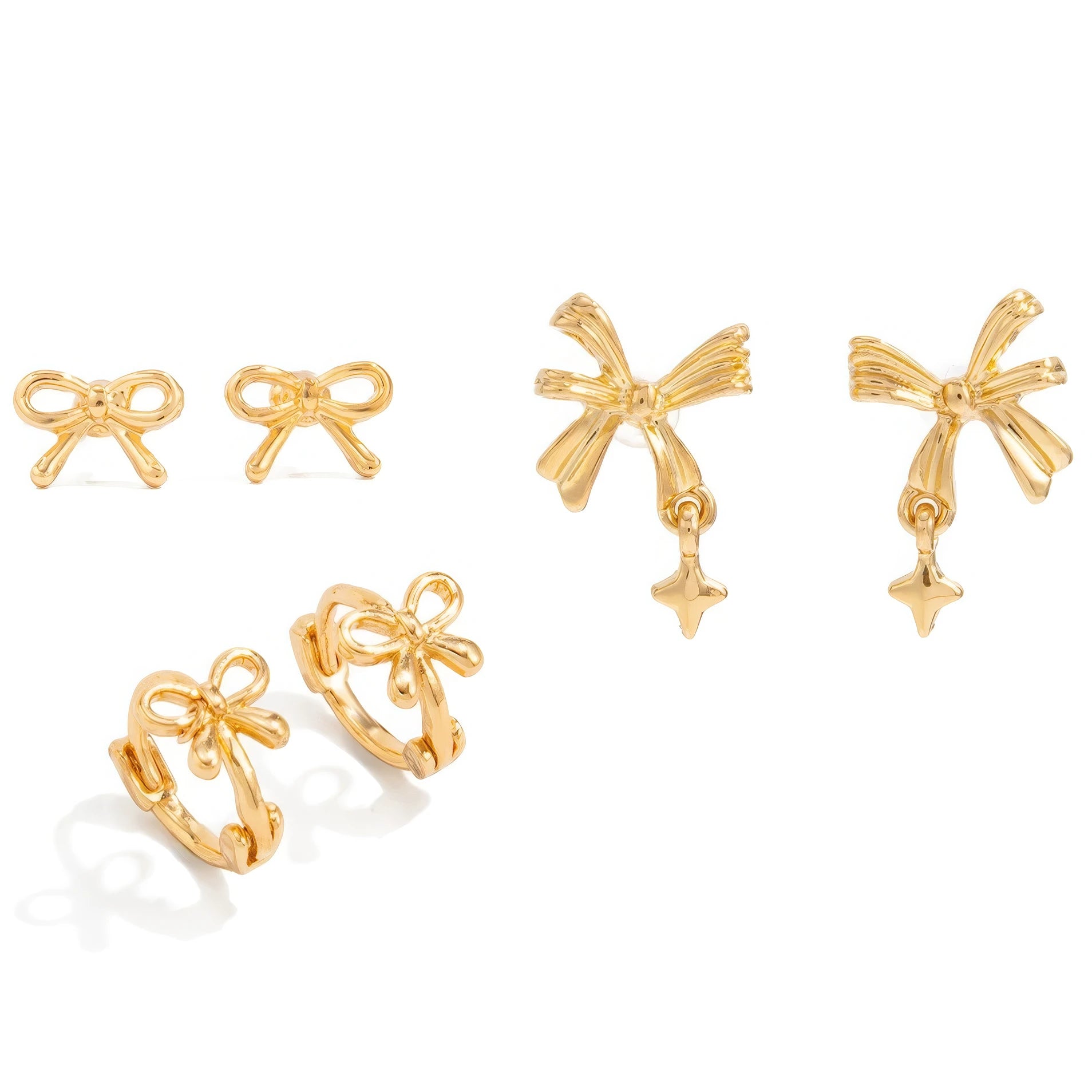 Another set of gold bow tie stud earrings isolated on white background.