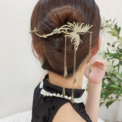 Gold butterfly tassel hair twist clip secured in a neat bun, showcasing the delicate gold finish and cascading tassels.