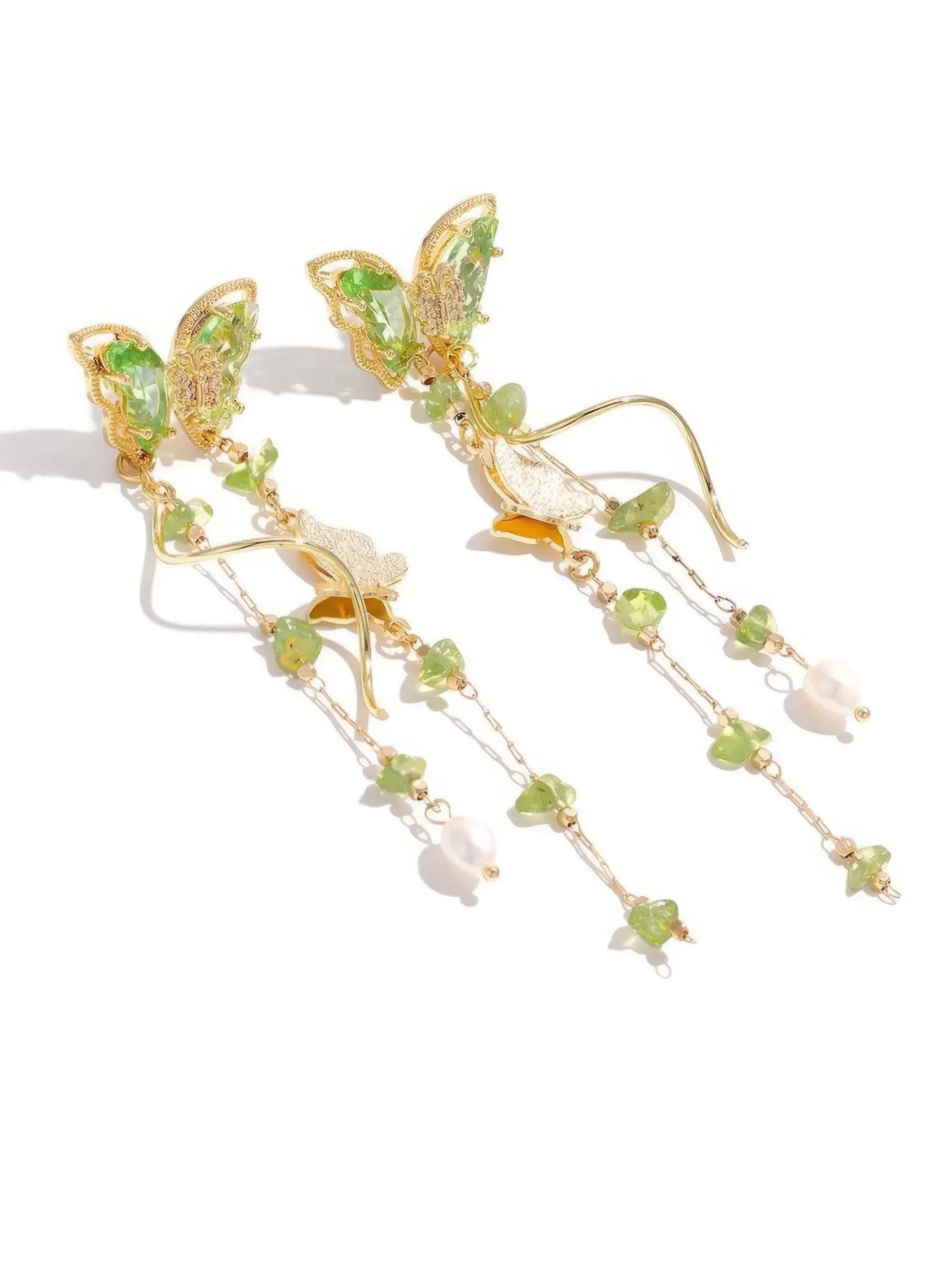 Side view of Green Wild Tea Butterfly Tassel Earrings, showcasing the delicate green and gold craftsmanship.