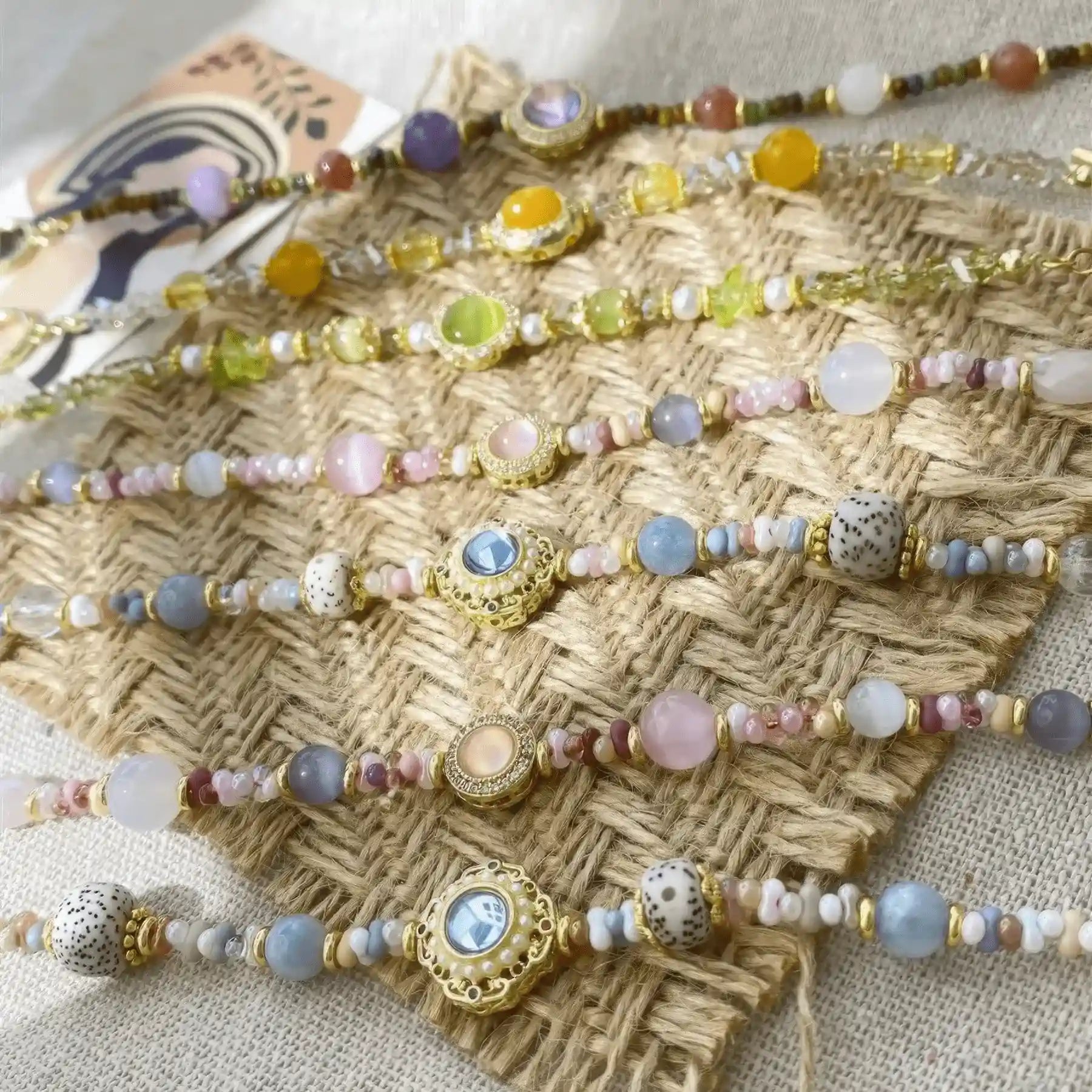  Assortment of handmade beaded bracelets displayed on a textured surface