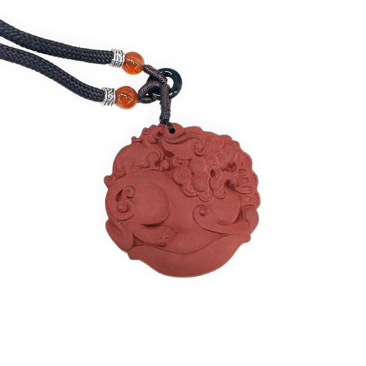 Close - up front view of the Huarui Pixiu incense pendant, highlighting the detailed carvings of the Pixiu on the reddish - brown pendant.