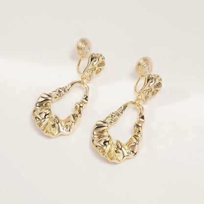  Irregular - shaped gold earrings, close - up isolated on white background, highlighting the crumpled - texture and open drop design
