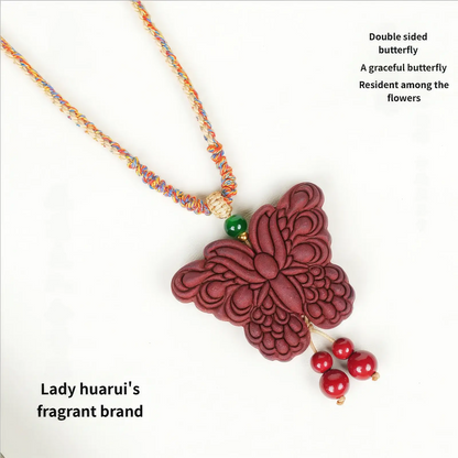  Full view of the Lady Huarui - Double-Sided Butterfly Incense Pendant on a colorful woven cord. The text on the image reads "Lady huarui's fragrant brand" and "Double sided butterfly. A graceful butterfly lingers among the flowers".
