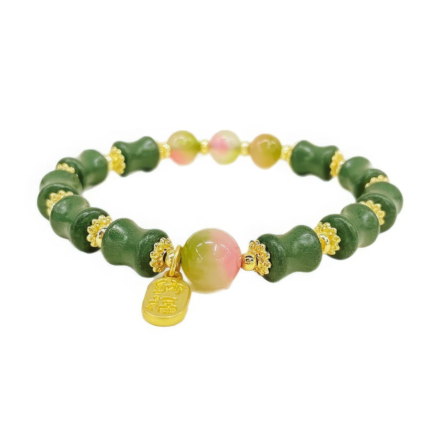 Full - view of the bracelet featuring green bamboo - shaped beads, a colorful watermelon chalcedony bead, and a golden charm.