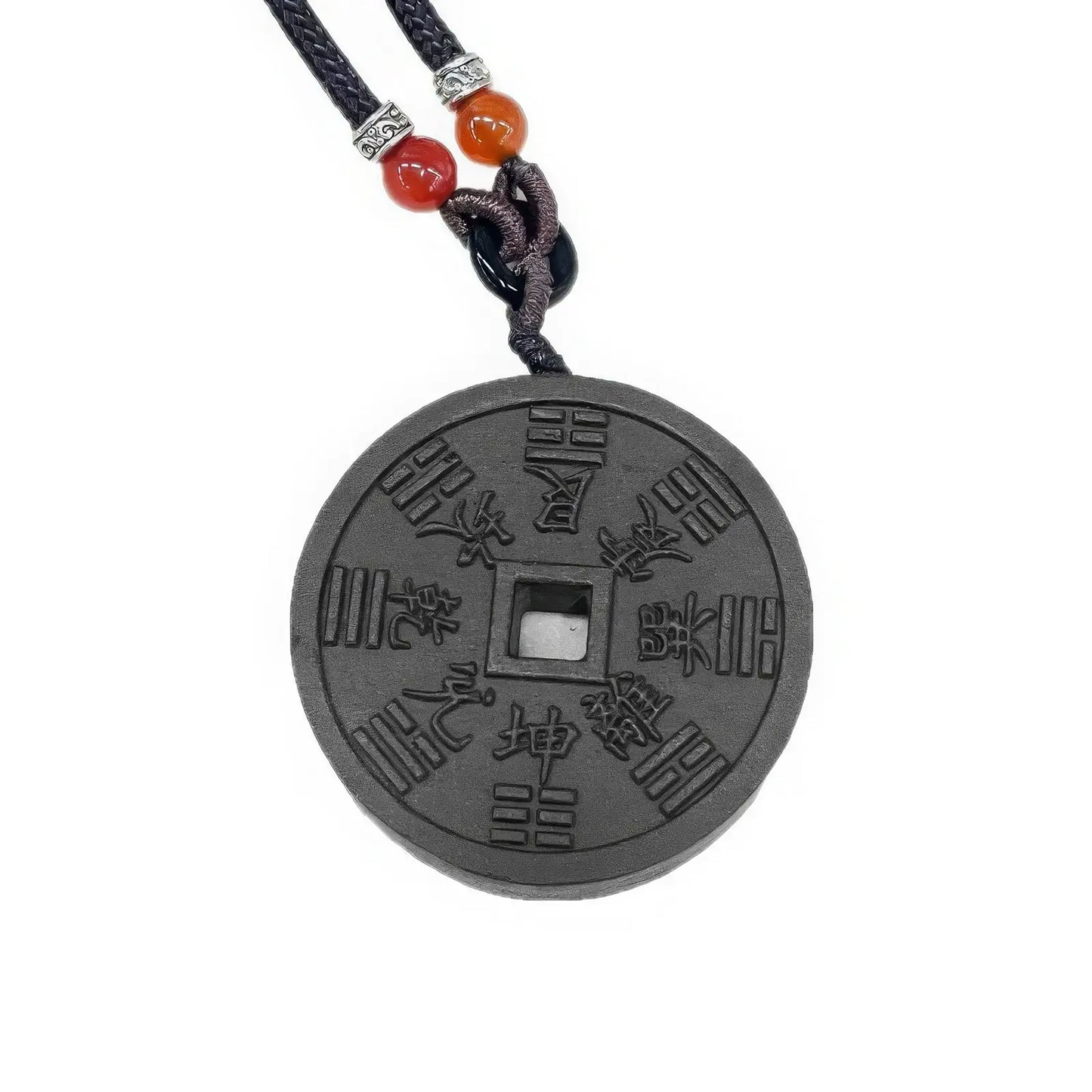 Close - up front view of the Mountain Ghost Amulet incense pendant, highlighting the inscriptions and patterns on the dark - colored circular pendant.