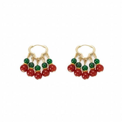 Pair of neo - Chinese palace - style beaded earrings, isolated on white background, highlighting the detailed red and green bead design.