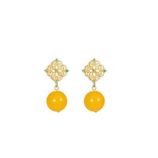 Pair of neo - Chinese style yellow bead earrings, isolated on white background, highlighting the intricate golden filigree and vibrant yellow bead design.