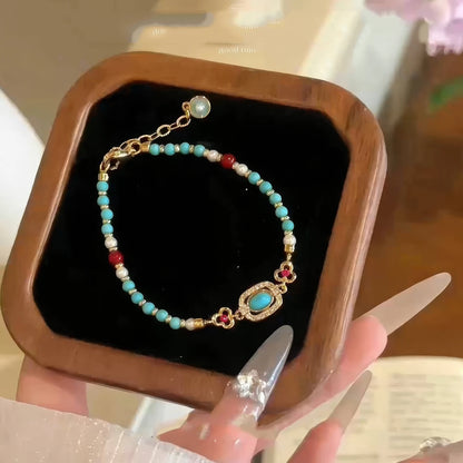 Neo - Chinese turquoise bracelet placed in a wooden box with black lining.