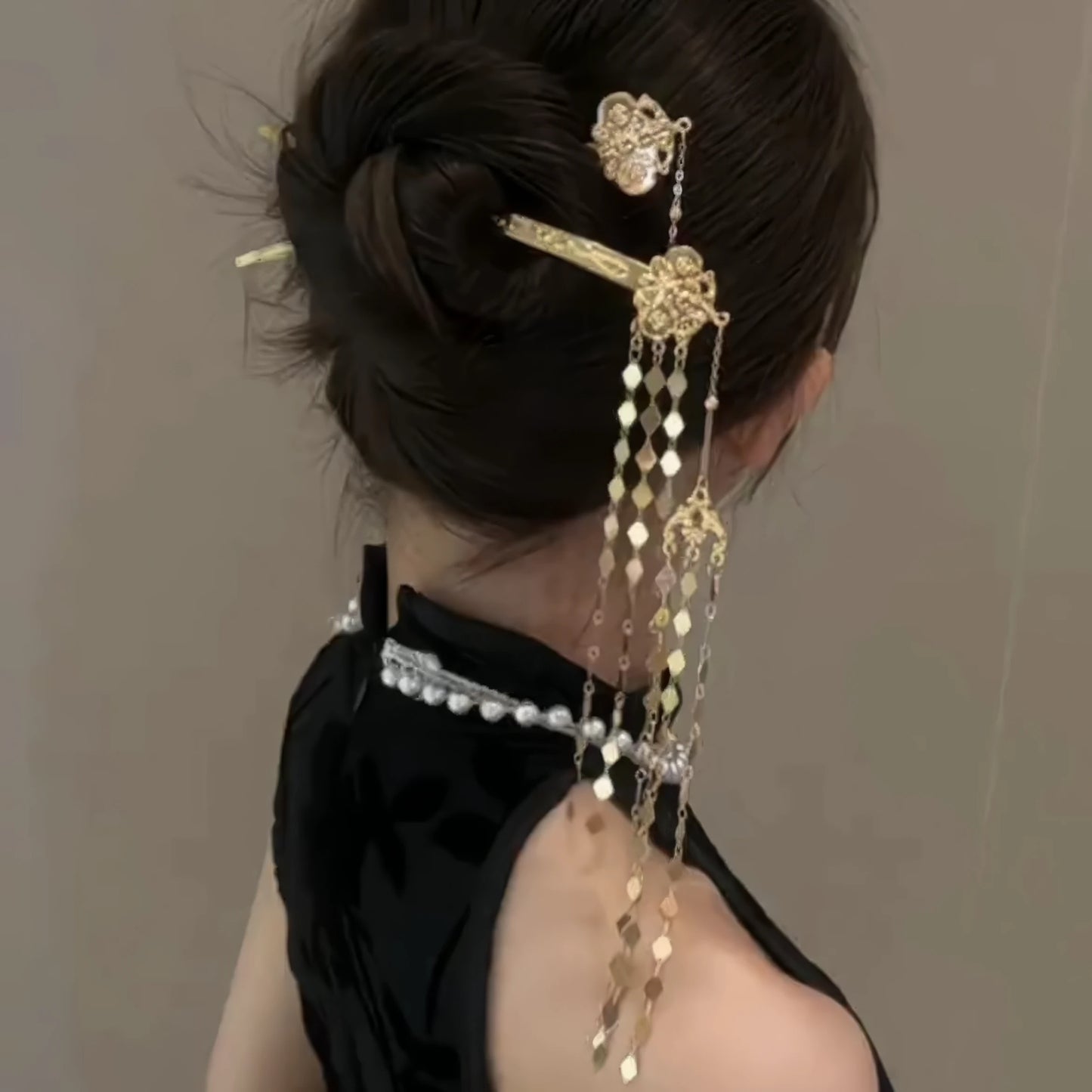 New Chinese - style rhombus - shaped hairpin with tassels worn in a bun, showcasing the side - back view and the tassel details.