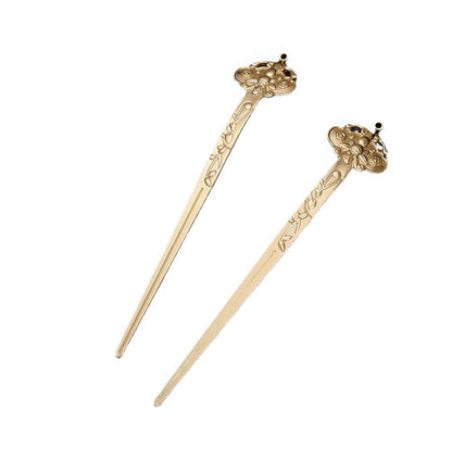 New Chinese - style rhombus - shaped hairpin without tassels isolated on a black background.