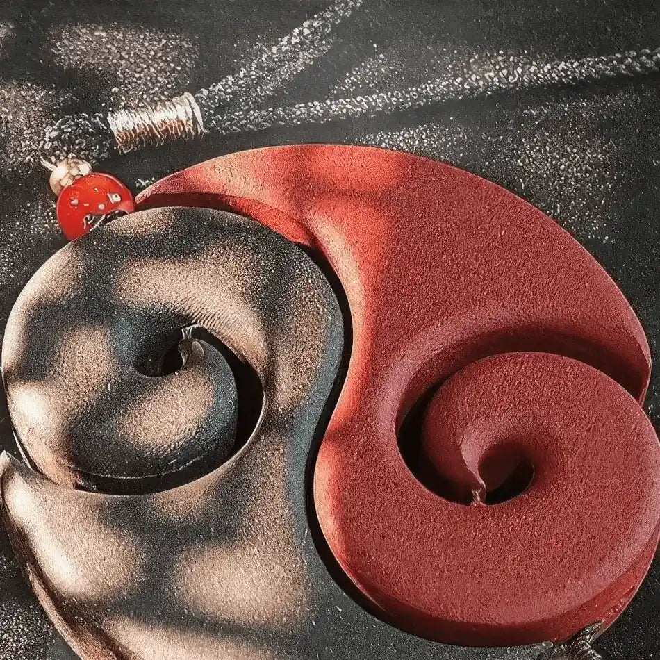  Close - up of the red and dark - colored pair of Nezha's Demon Pill incense pendants, highlighting their intricate spiral - like design.