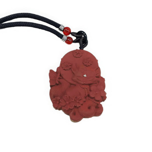 Close - up view of one side of the Nine - Tailed Fox double - sided incense pendant, showcasing the detailed carving of the fox and floral patterns.