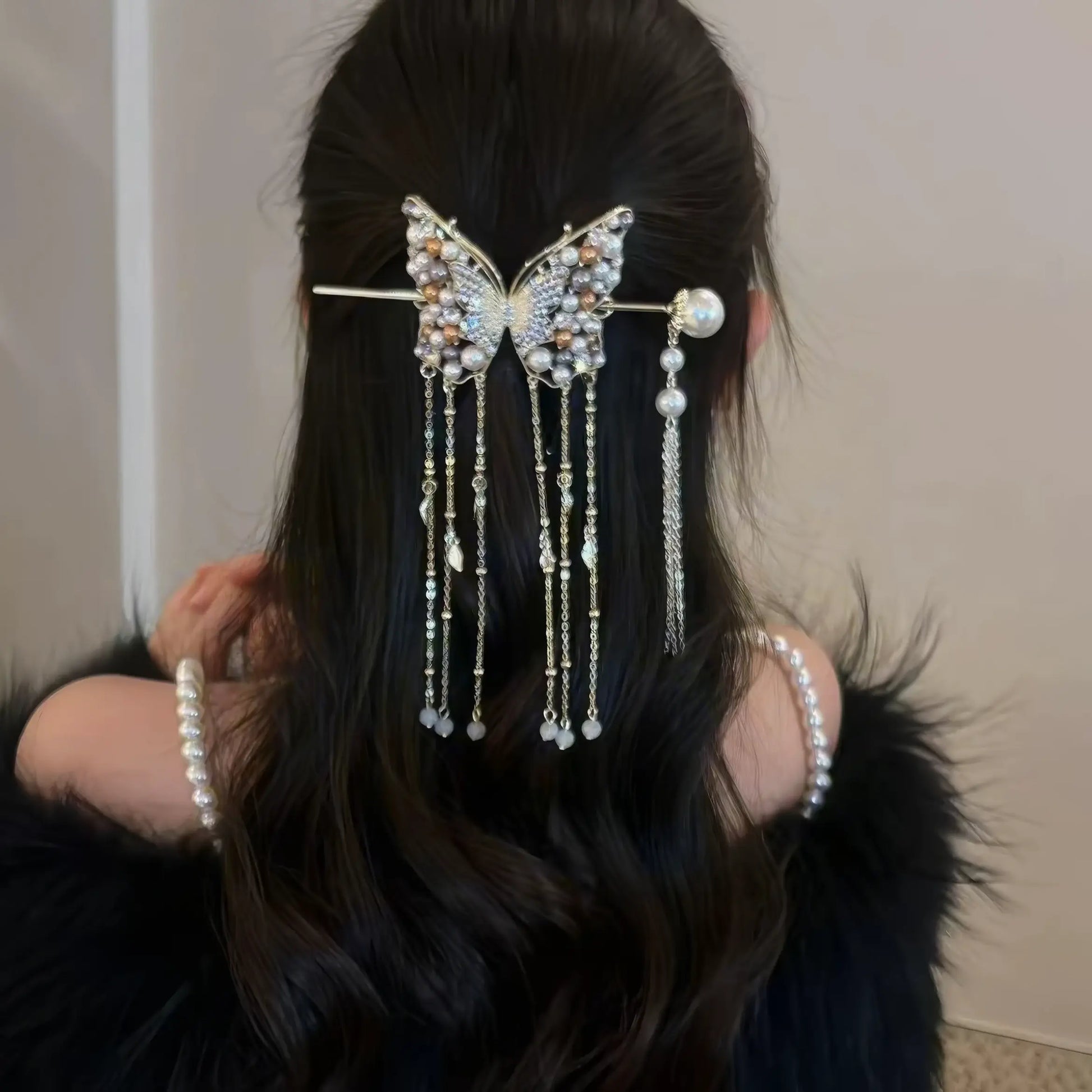 Back view of long half-tied hair decorated with butterfly pearl tassel hairpin set, paired with pearl necklace for delicate oriental aesthetic.