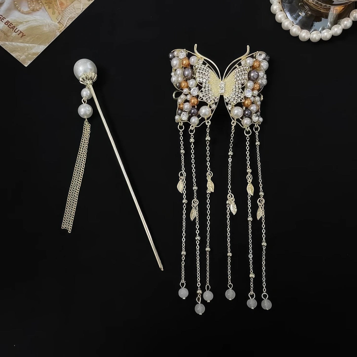Separated display of butterfly tassel hairpin and individual pearl tassel hair stick, showing two pieces of the matching hair accessory set.