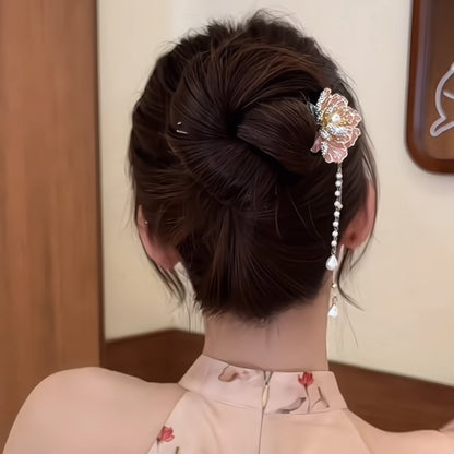 Back view of the same peony flower hairpin with an adjusted double pearl chain tassel, shown on a bun paired with a floral-printed cheongsam.