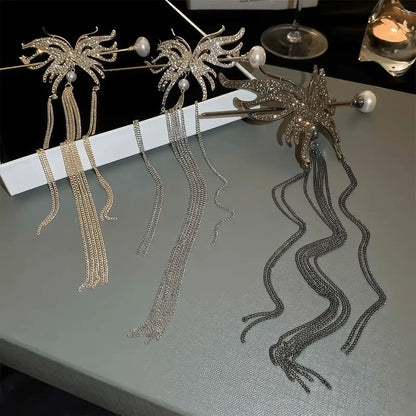 Three-toned rhinestone butterfly tassel hairpin sets (silver, gold, gunmetal) laid flat on table, showing different length metal tassel designs for comparison.