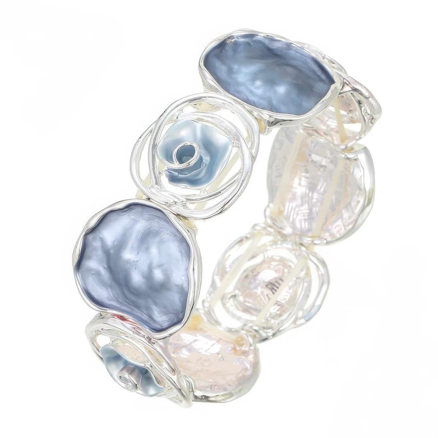  Rose - themed bracelet in silver with blue and clear stones, placed on a wooden surface.
