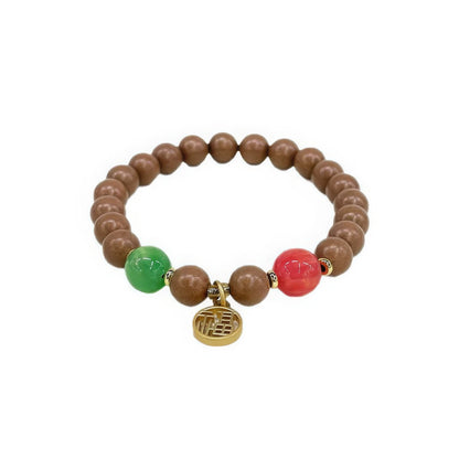 Full - view of the sleep - aiding natural Chinese medicine incense bead bracelet, featuring brown beads, green and red accent beads, and a gold - toned pendant.