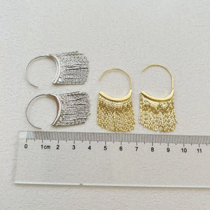 Mixed gold and silver tassel C - shaped earrings with size info via ruler, highlighting the dangling tassel design and variety