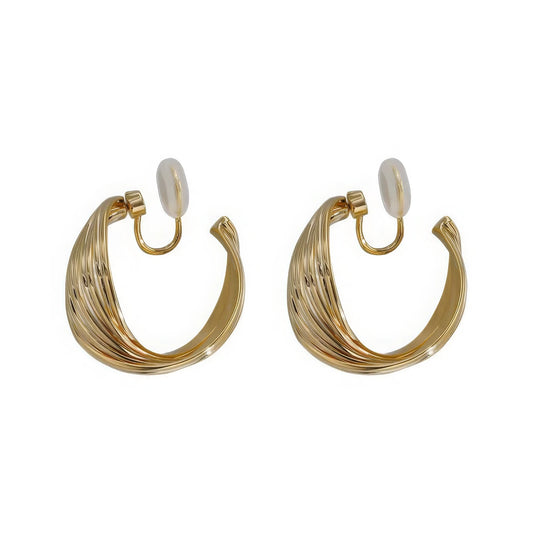 Gold textured line - ring ear cuffs, isolated on white background, highlighting the intricate, layered structure